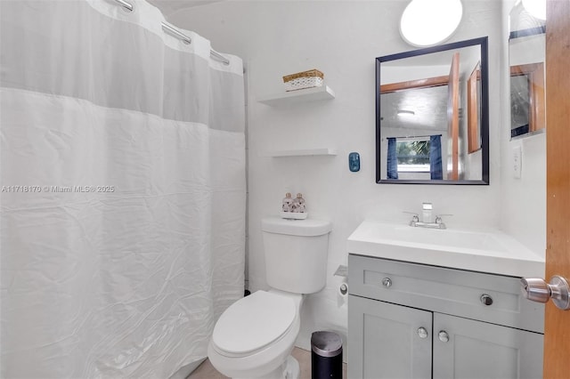 bathroom with vanity, tile walls, and toilet