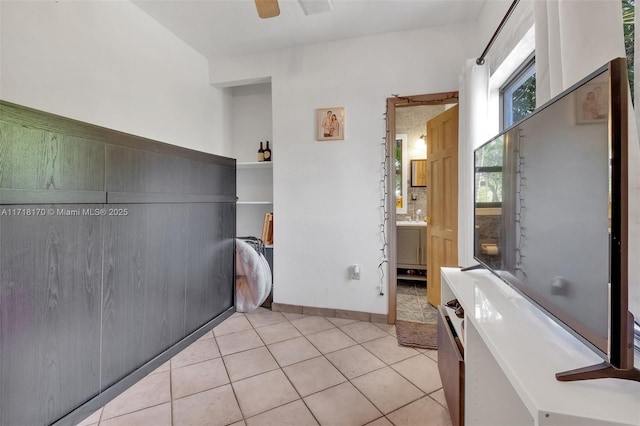 tiled bedroom featuring ceiling fan and access to outside