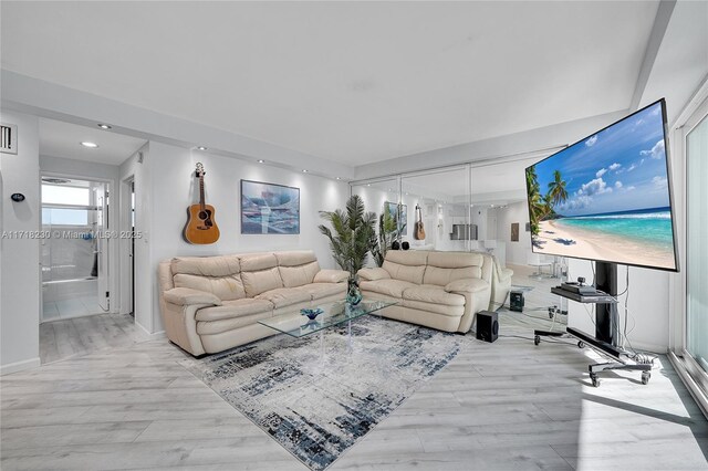 living room with light hardwood / wood-style flooring