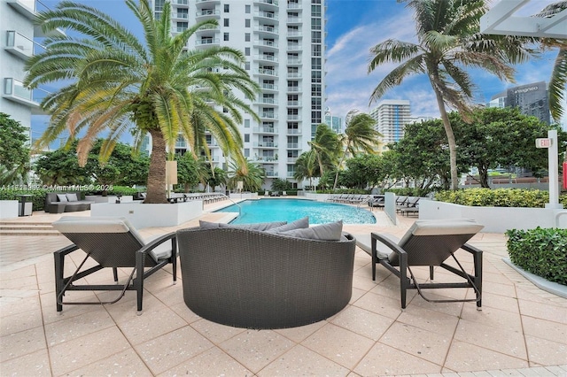 view of swimming pool with a patio