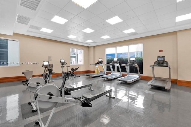 workout area featuring a drop ceiling