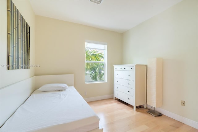 bedroom featuring light wood-type flooring