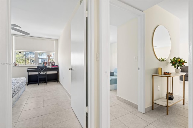 corridor with light tile patterned flooring