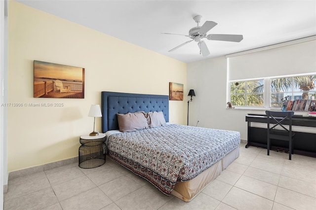 bedroom with ceiling fan and light tile patterned floors