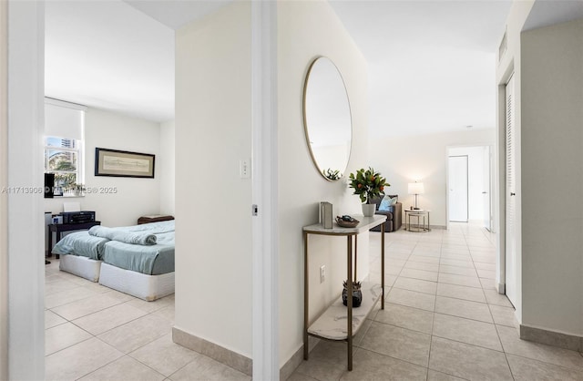 hall with light tile patterned flooring