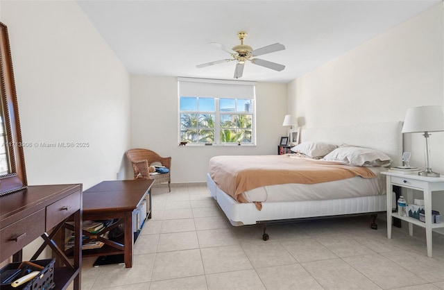 tiled bedroom featuring ceiling fan