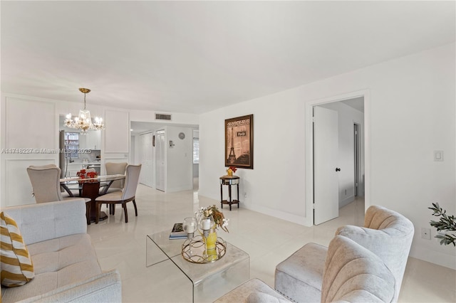 living room with an inviting chandelier