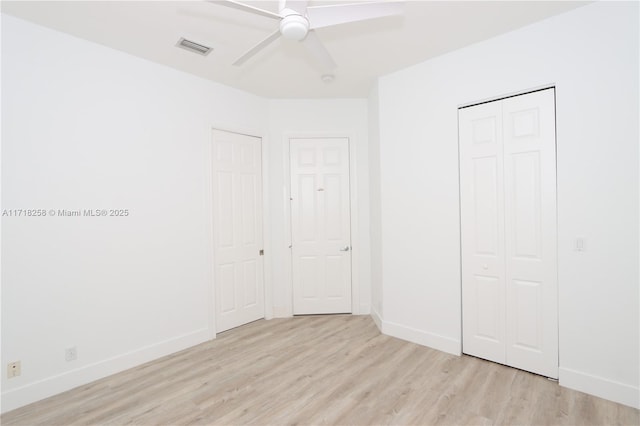 unfurnished bedroom featuring light hardwood / wood-style flooring and ceiling fan