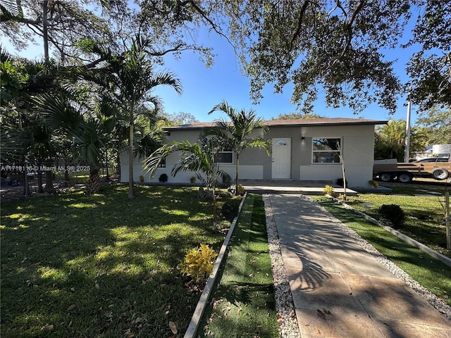 ranch-style home with a front yard