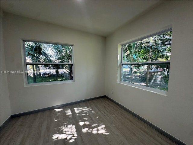 spare room featuring dark hardwood / wood-style floors