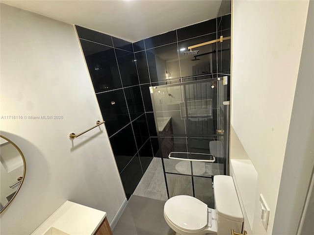 bathroom featuring toilet and walk in shower