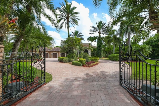 view of gate with a yard