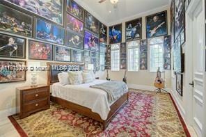 bedroom featuring baseboards