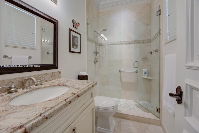 full bath with vanity, toilet, a shower stall, and crown molding