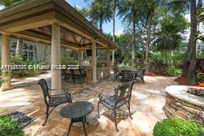 view of patio / terrace featuring a gazebo and a fire pit