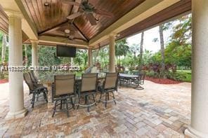 view of patio / terrace featuring a gazebo and ceiling fan