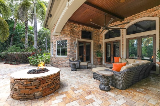 view of patio / terrace featuring french doors and a fire pit