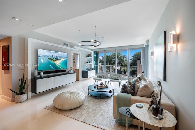 tiled living room with floor to ceiling windows and a notable chandelier