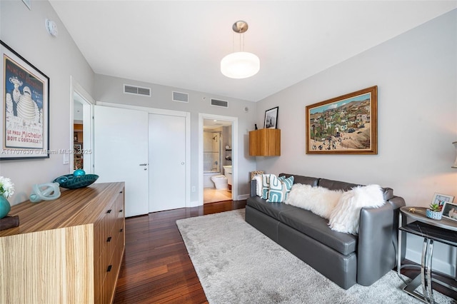 living room featuring dark wood-type flooring