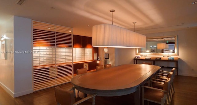 dining room with dark wood-type flooring