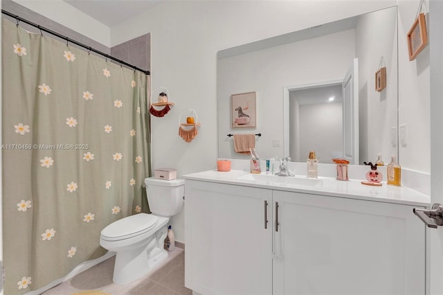 bathroom featuring tile patterned floors, vanity, and toilet