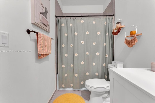 full bathroom featuring vanity, toilet, and shower / bath combo with shower curtain