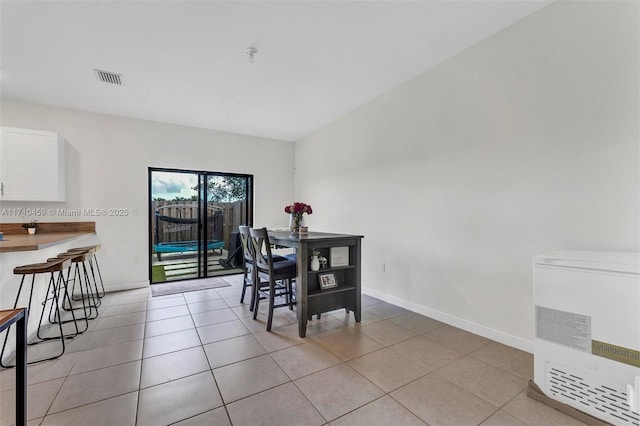 dining room featuring light tile patterned floors