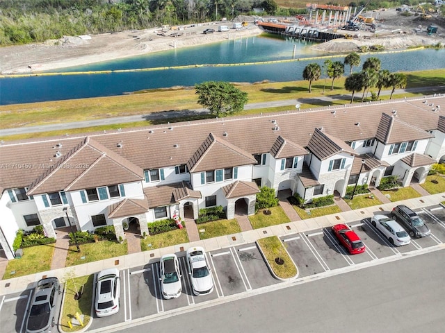 birds eye view of property with a water view