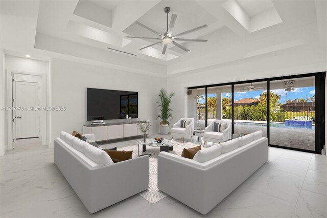 spare room featuring a towering ceiling, ceiling fan, and coffered ceiling