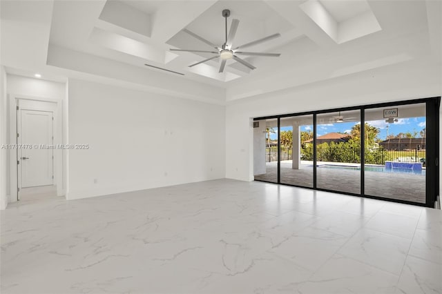 unfurnished room with coffered ceiling, a towering ceiling, ceiling fan, and beam ceiling