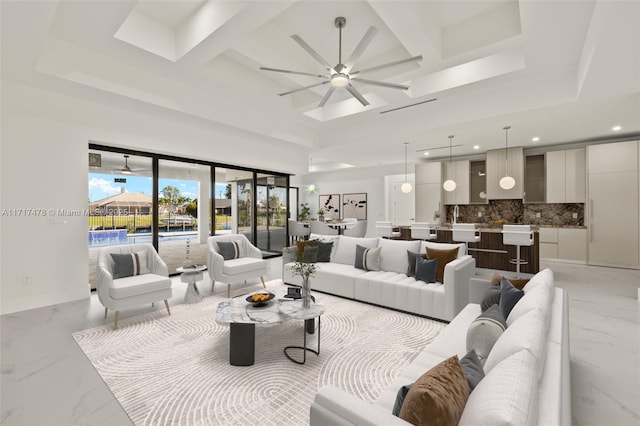 living room featuring coffered ceiling, a towering ceiling, ceiling fan, and beam ceiling