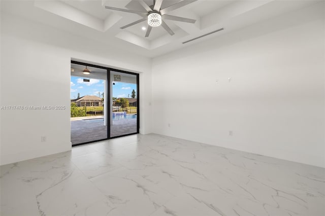 unfurnished room featuring coffered ceiling, ceiling fan, and beamed ceiling