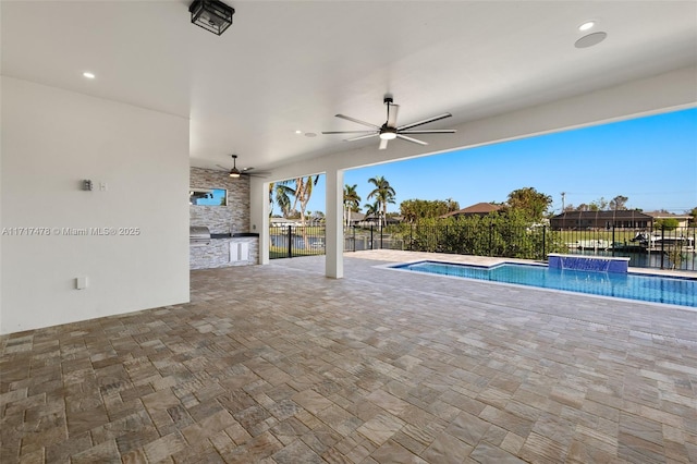 view of pool featuring a patio, area for grilling, and ceiling fan