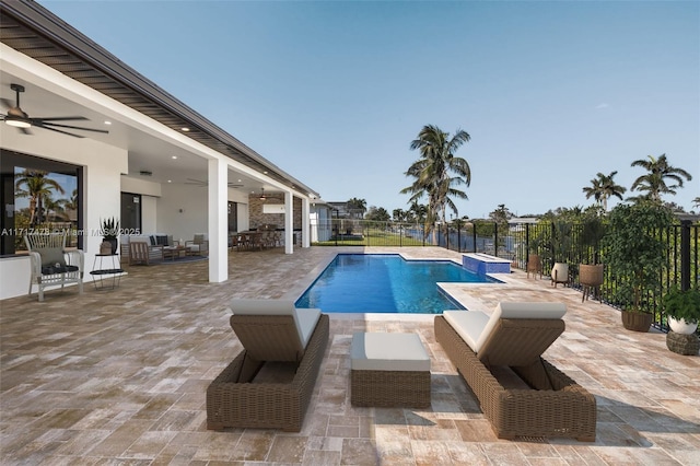 view of pool with a patio area and ceiling fan