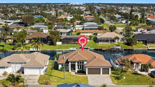 birds eye view of property with a water view