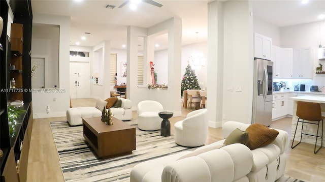 interior space with light hardwood / wood-style flooring and ceiling fan