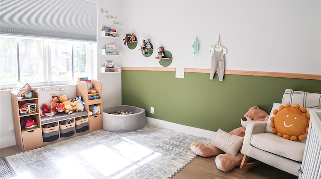 playroom with hardwood / wood-style flooring