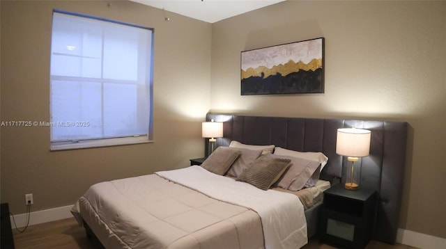 bedroom featuring wood-type flooring