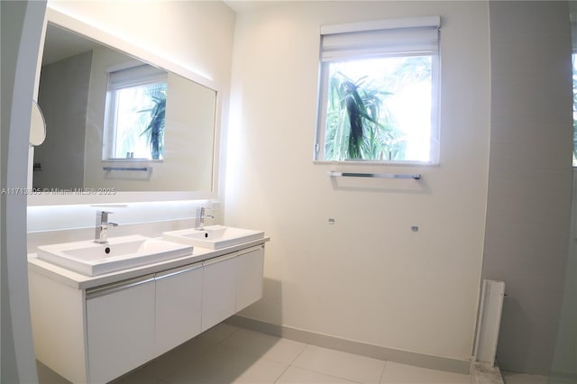 bathroom with tile patterned floors and vanity