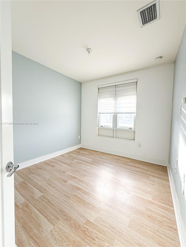 empty room with light wood-type flooring