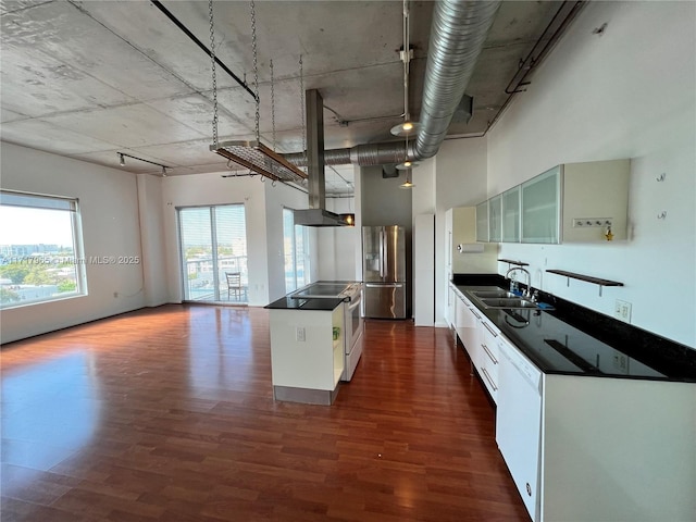 kitchen with stainless steel refrigerator with ice dispenser, sink, white cabinetry, plenty of natural light, and dishwasher