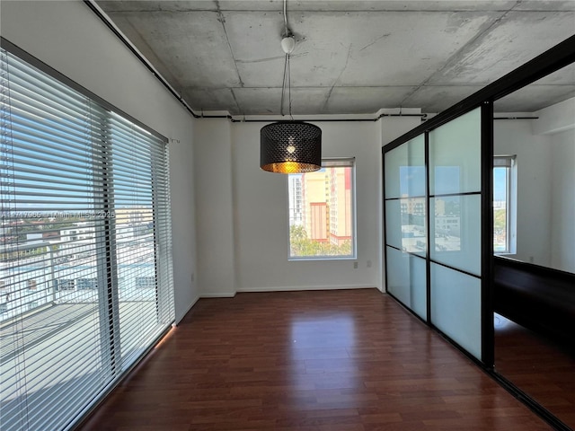 spare room with dark hardwood / wood-style flooring