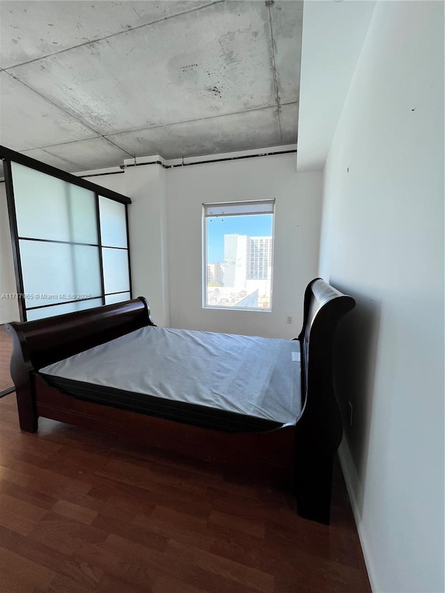 unfurnished bedroom featuring hardwood / wood-style floors