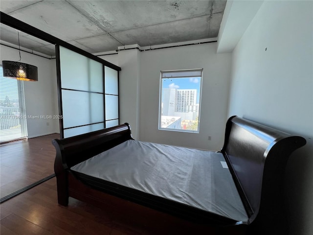 bedroom featuring dark hardwood / wood-style floors