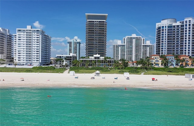 exterior space featuring a view of the beach and a water view