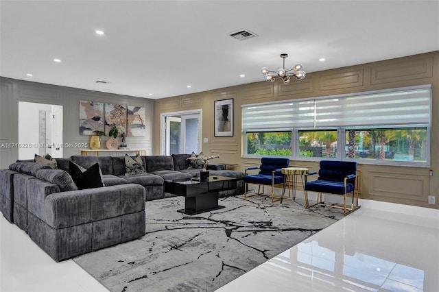 living room featuring a notable chandelier