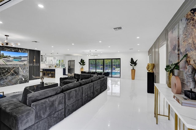 living room with light tile patterned floors and ceiling fan