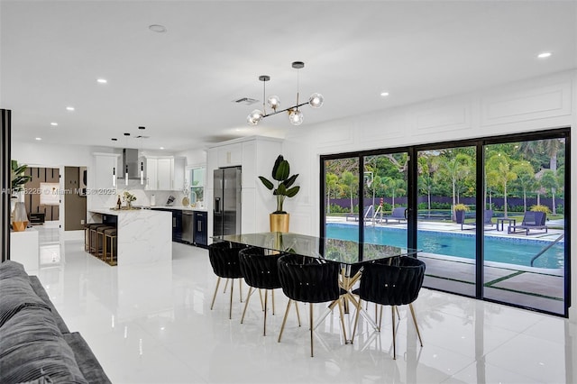 tiled dining space featuring sink