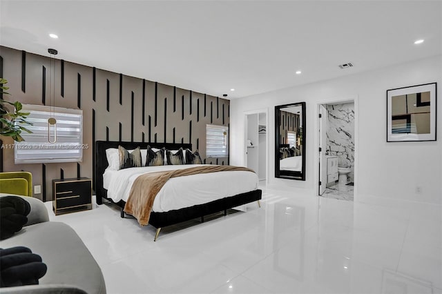 bedroom featuring ensuite bath