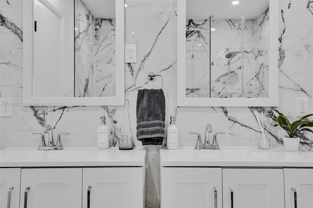 bathroom with vanity and a shower